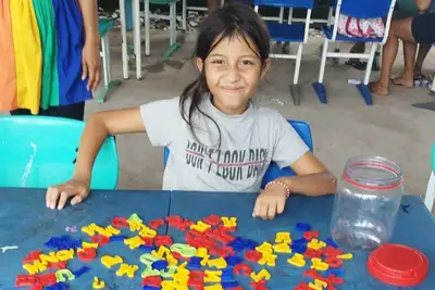 notícia: Projeto de incentivo à leitura leva diversão e conhecimento às crianças durante o 'Governo em Ação' no bairro Brasil Novo, em Macapá 